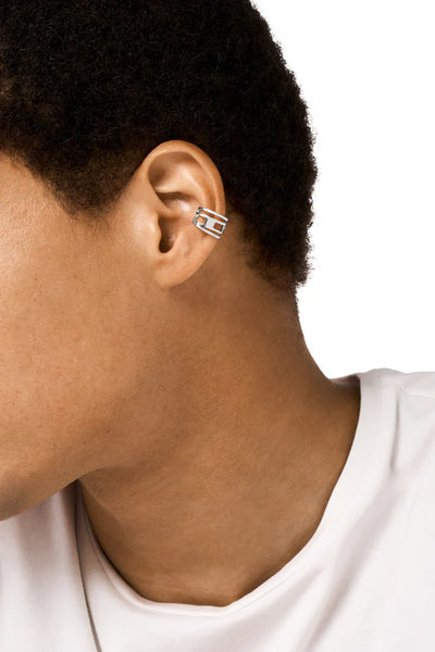 Stainless steel ear cuff features the D logo in a wrapped design