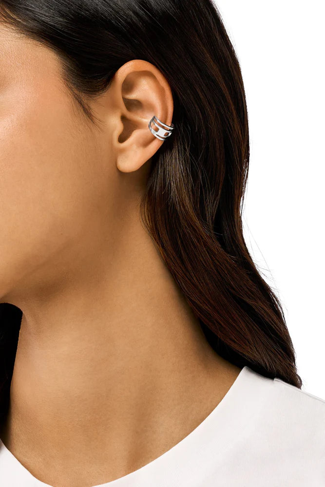 Stainless steel ear cuff features the D logo in a wrapped design